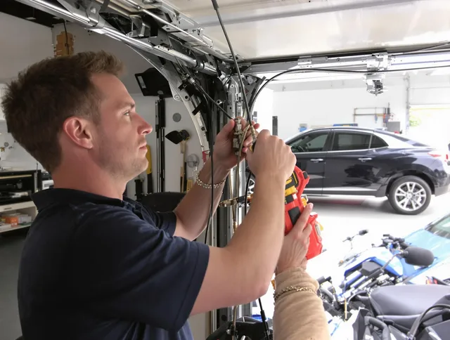 Palm Harbor Garage Door Repair safety certified technician performing cable replacement in Palm Harbor