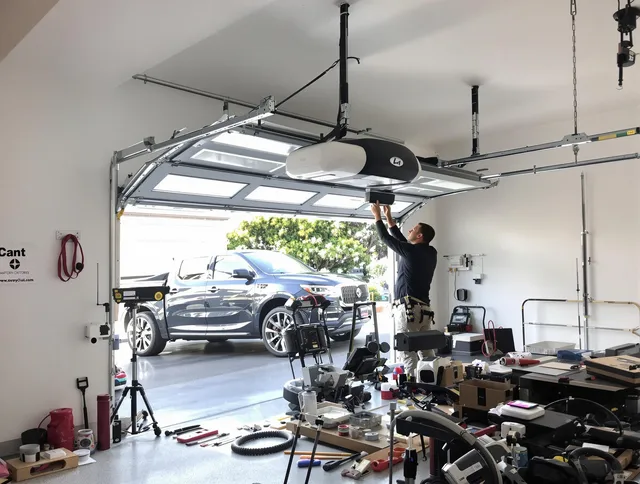 Palm Harbor Garage Door Repair specialist installing smart garage door opener system in Palm Harbor home